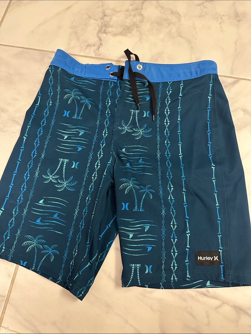 Boys size 10 Hurley Teal and Light Blue Palm-Pattern Boardshorts/swim trunks